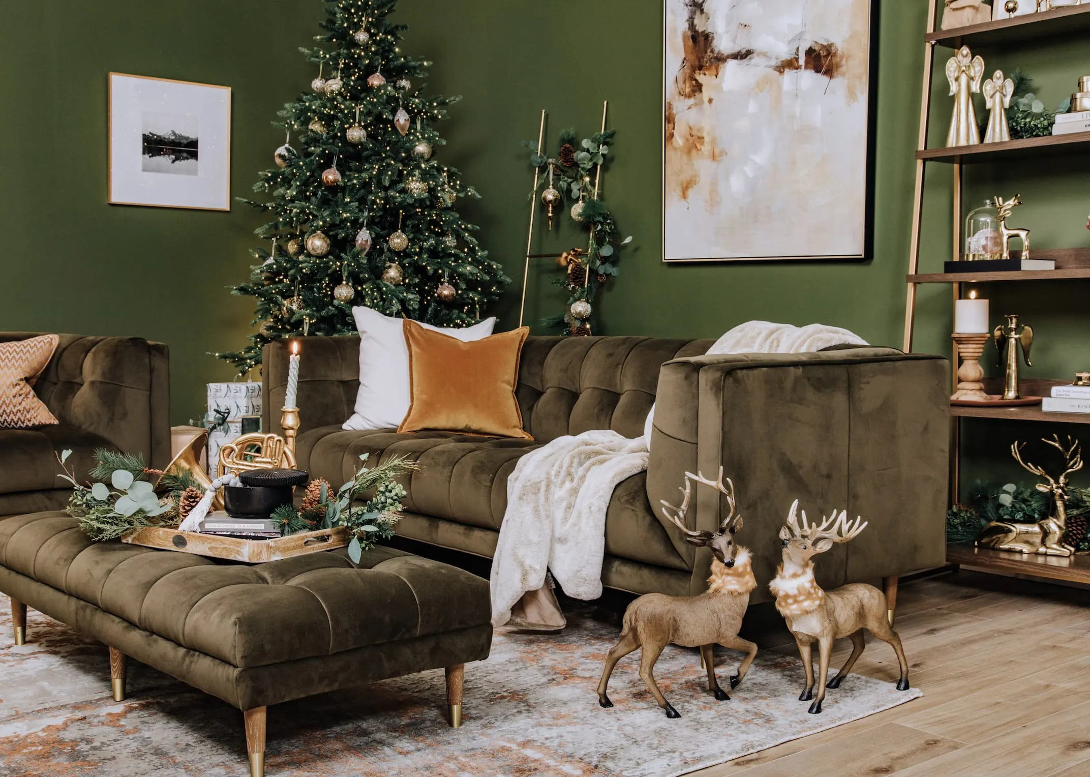 A lifestyle image of the Grace Velvet sofa with Derr with fur scarf in both sizes and Rockefeller tree.