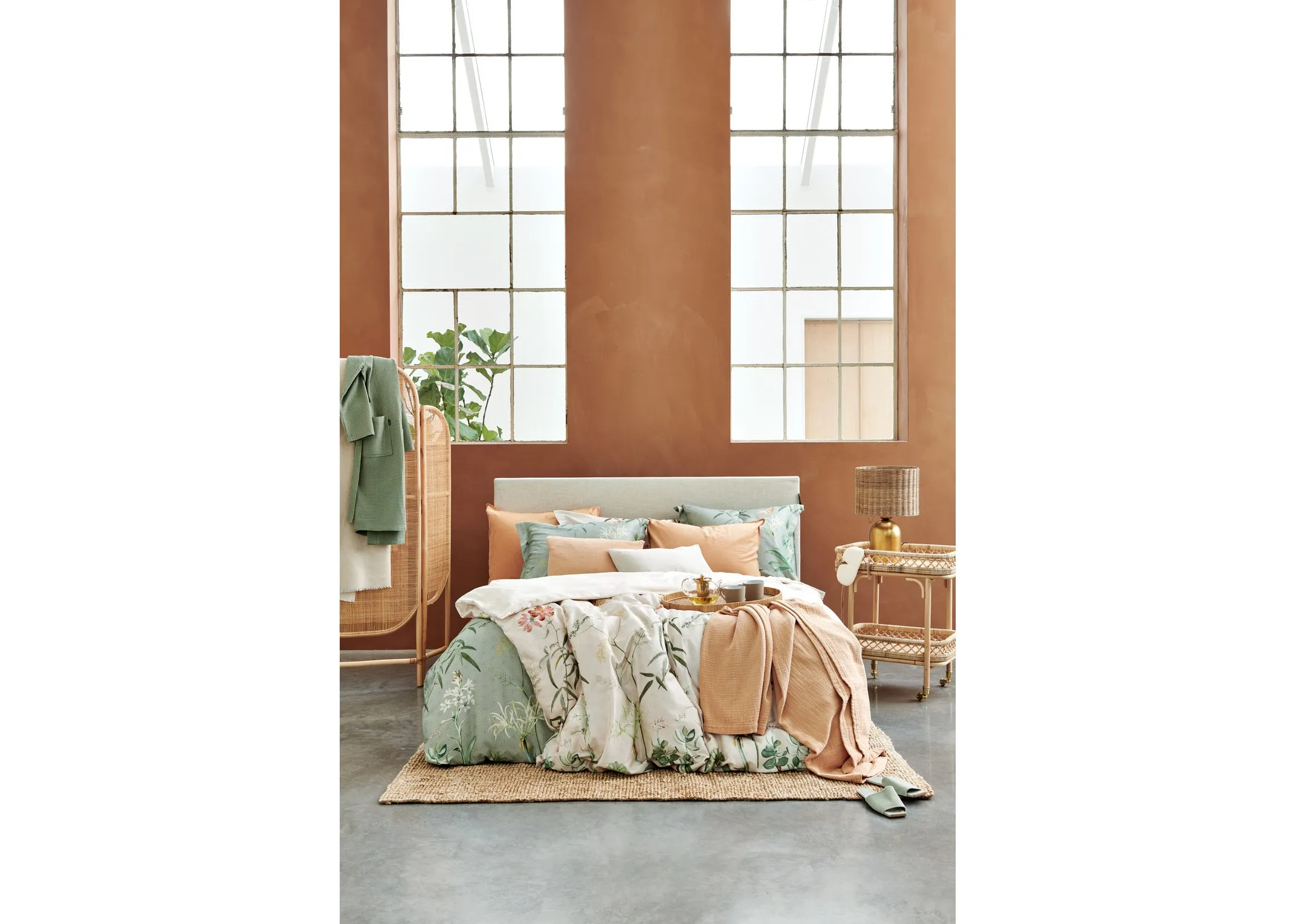 A lifestyle image of the Flower Garden & apricot duvet covers & bedspreads from Van Dyck.