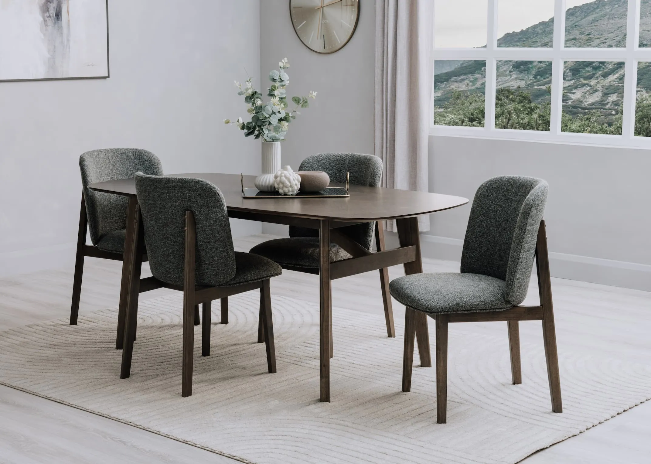 A lifestyle image of the Bergen Dining set with the Elio rug from EZ Living Furniture.