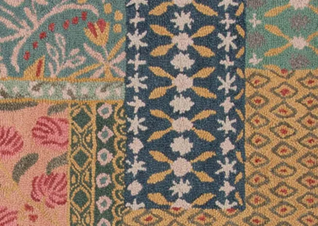 A patchwork rug with pink flowers & green blue red and yellow design from EZ Livings Greco range.