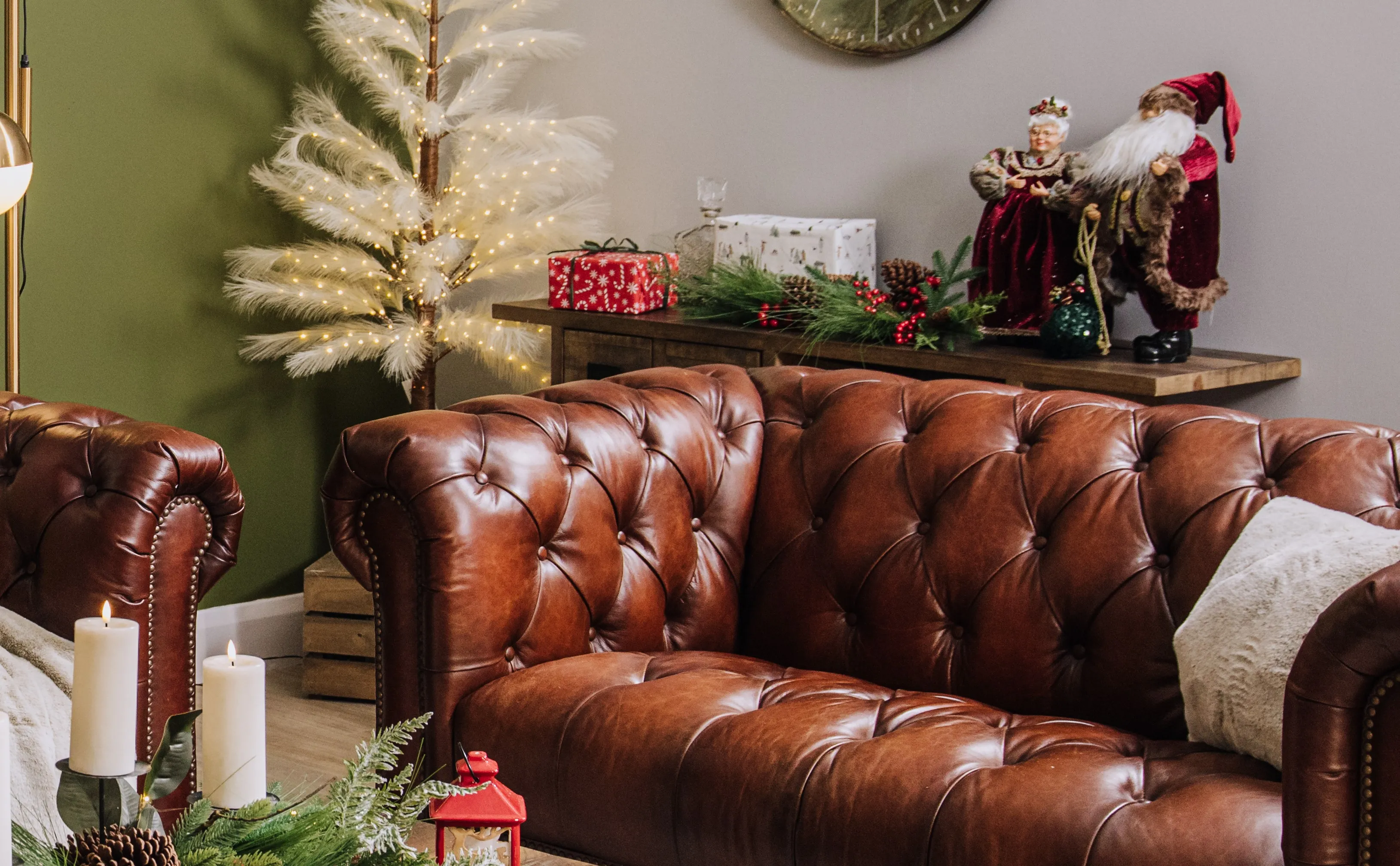 A lifetsyle image of the Adare sofa with Reed tree with Mr & Mrs Santa on a sideboard.