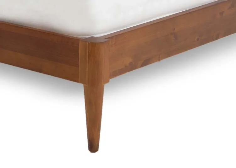 A king size dark wood bed frame from EZ Livings Leya range. Closeup of tapered leg