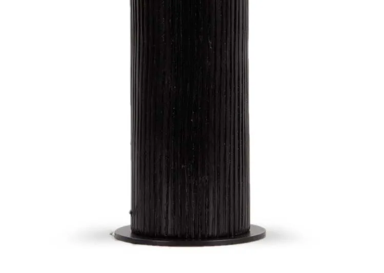 A black pannelled table lamp with white barrel shade from EZ Livings Lohas range. Closeup of panelled lamp base