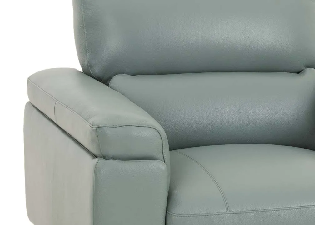 A petrol blue leather armchair from EZ Livings Lagoon range. Closeup of padded armrest