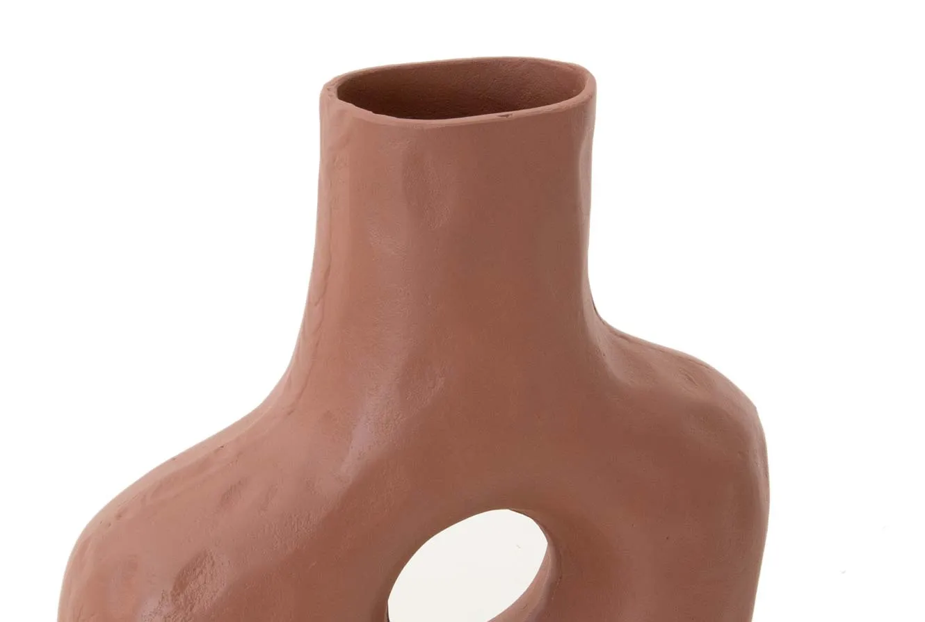 A lifestyle image of the Milo dresser with PAsur candleholders and Terrcotta vase.