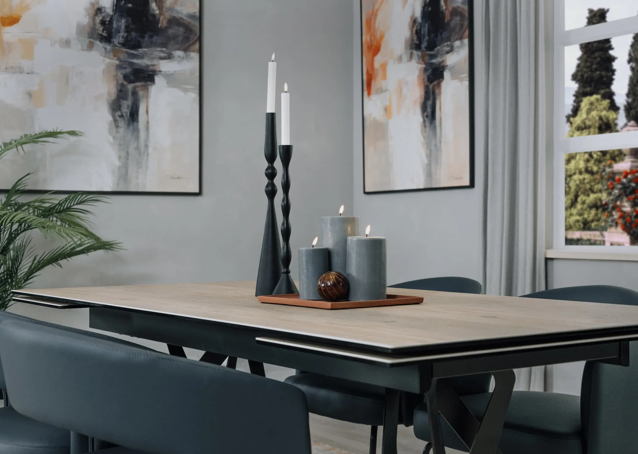 A lifestyle image of the Kingston dining table with terracotta tray with Grey Deluxe LED Candles and 2