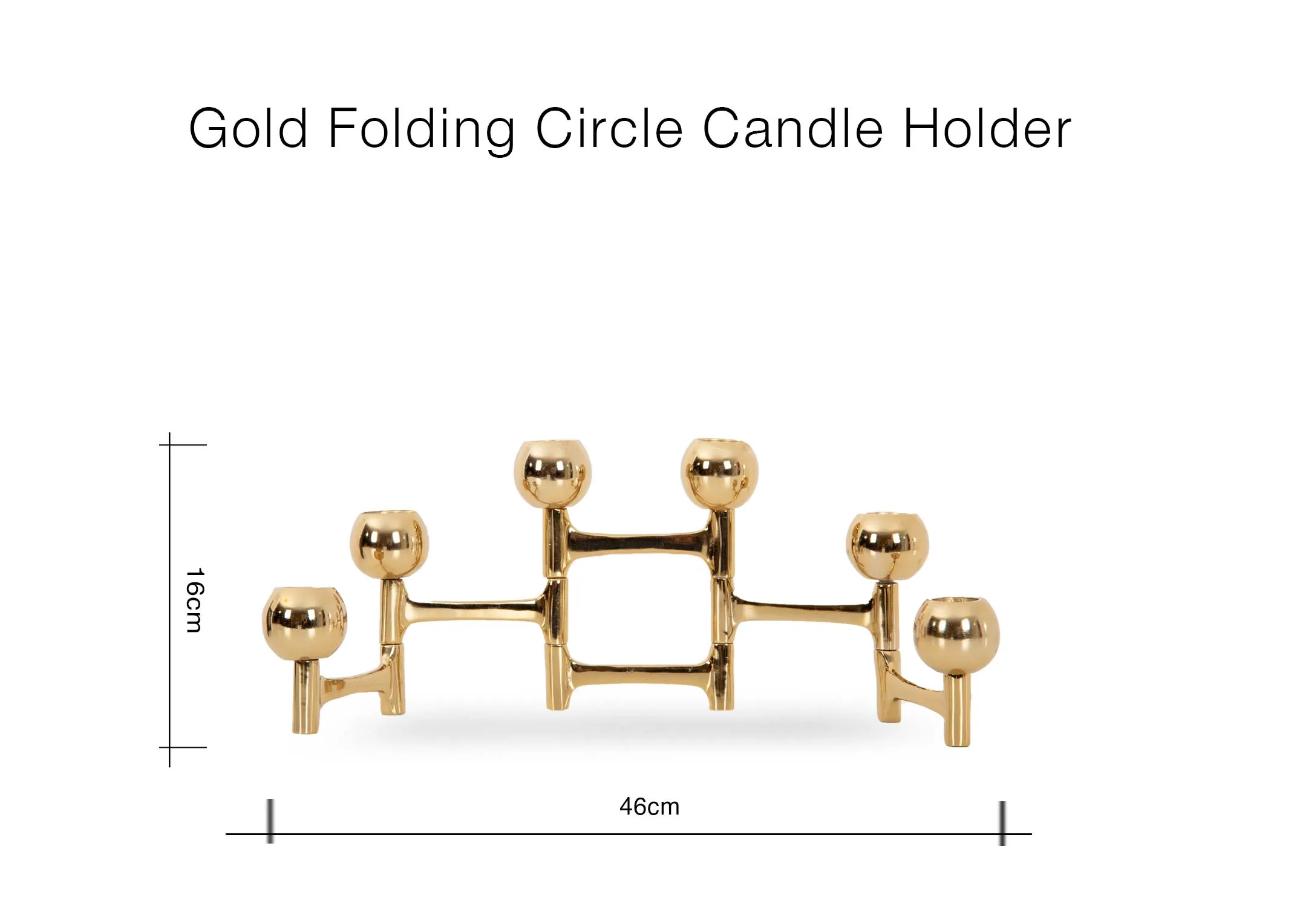 A lifestyle image of the Rockefeller tree with the gold folding candle holder below it with candles lit.