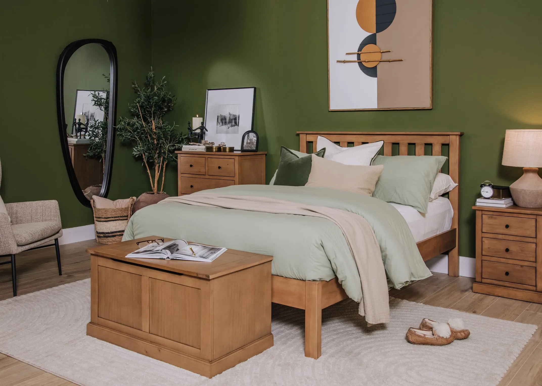 A lifestyle of the Atlas rustic bedframe with green vandyck sheets and matching atlas blanket box & locker.