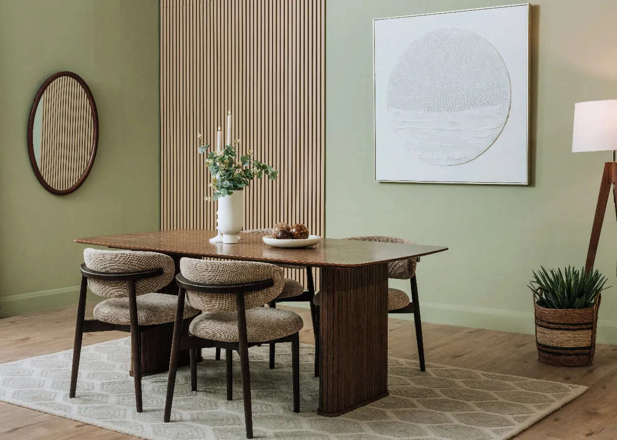 A lifestyle image of the Nola smoked oak dining table with Hazel dining chairs