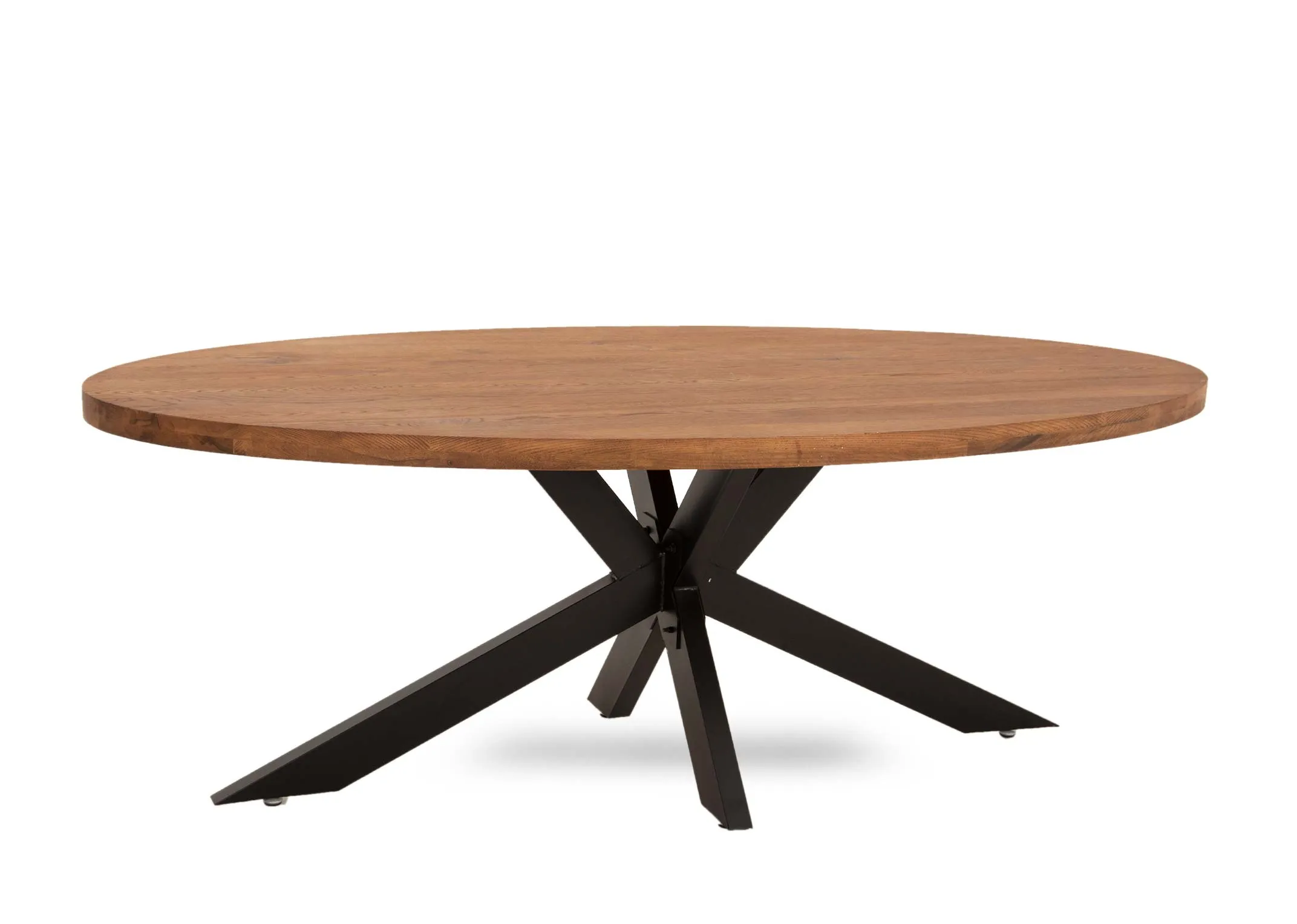 An oval oak dining table with black x legs from EZ Living Furniture's Oslo range. Angled view of thick table top.