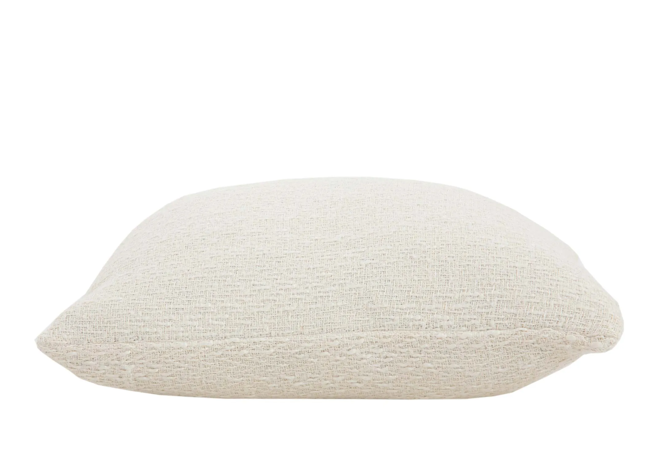 A cream knitted cushion from EZ Livings Cushion range. Side view