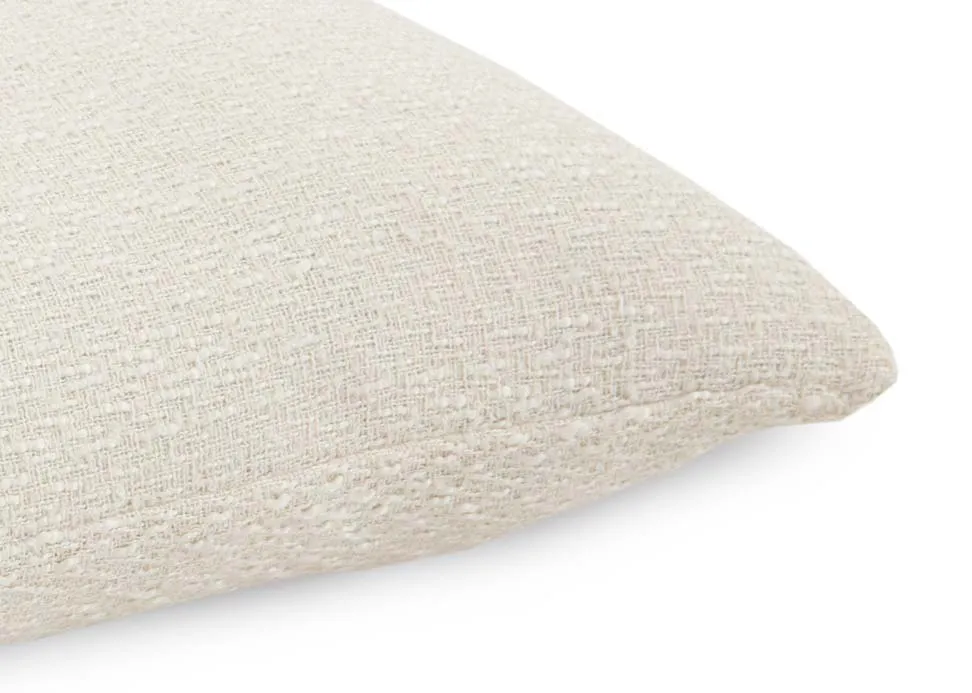 A cream knitted cushion from EZ Livings Cushion range. Closeup of  fabric.