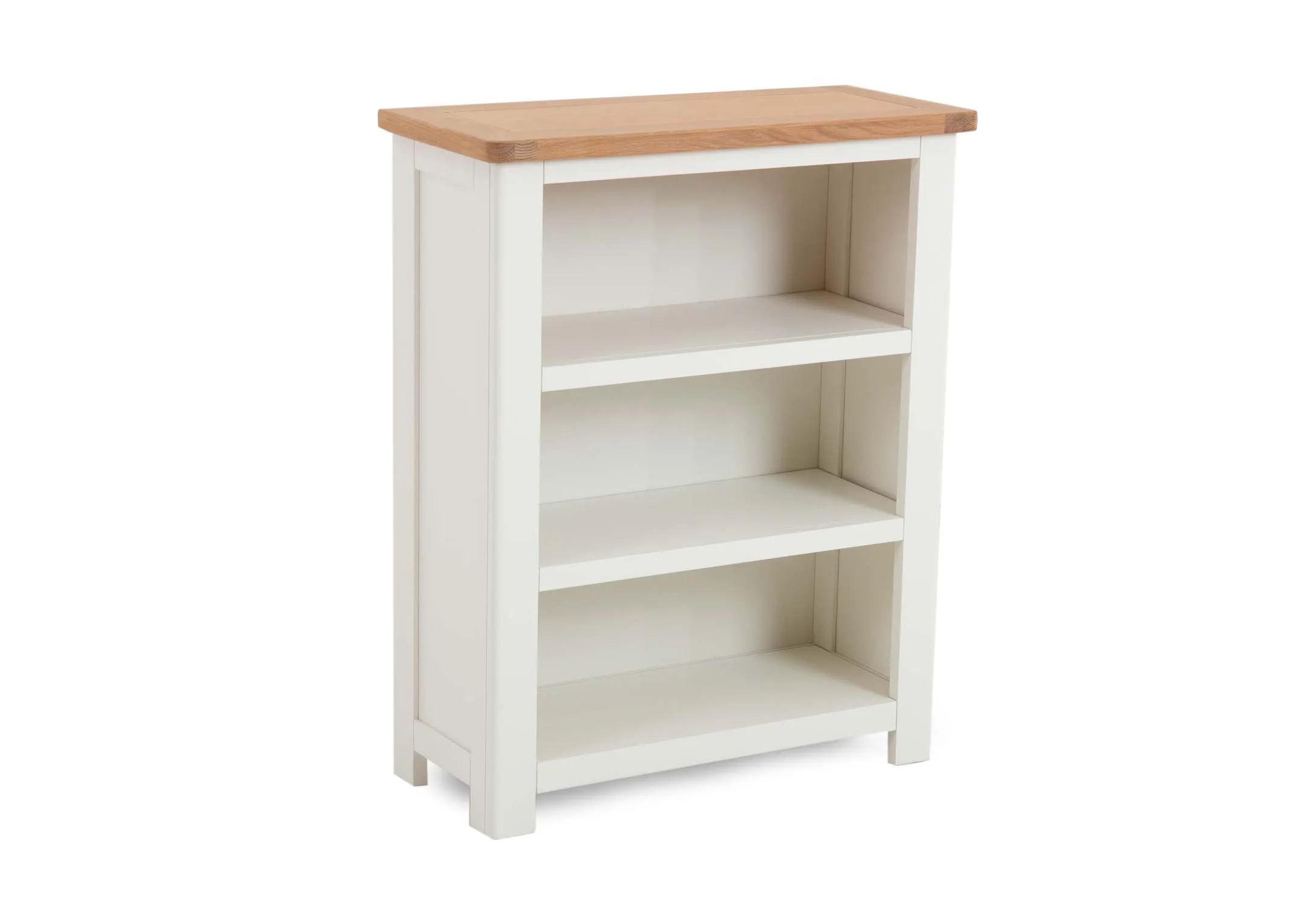 A white 3 shelf bookcase with oak top from EZ Livings Barleycove range. Angled view of white shelves and wood top.