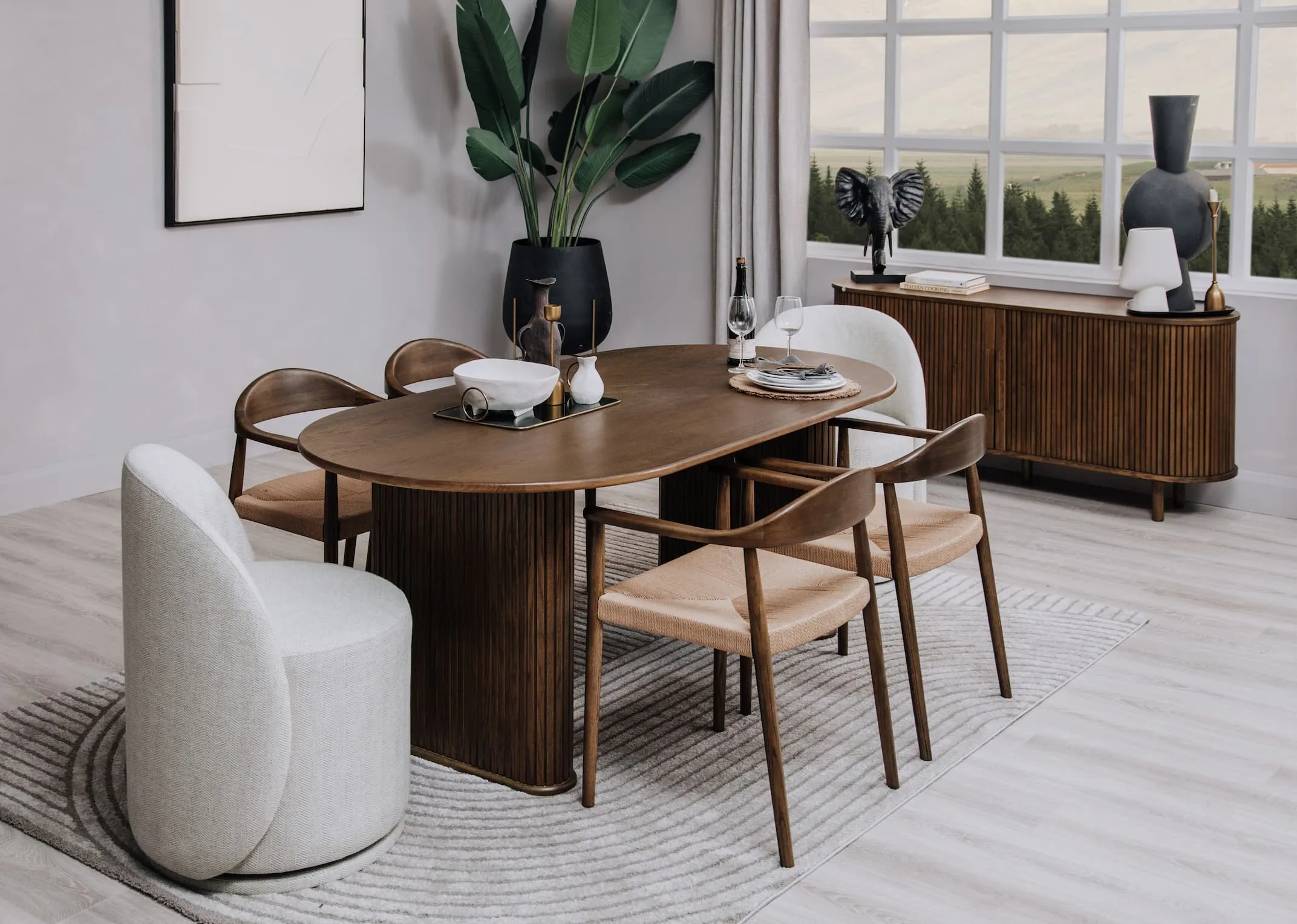 A lifestyle image of the Rosana cream dish on a tambour dining table with Marion chair.