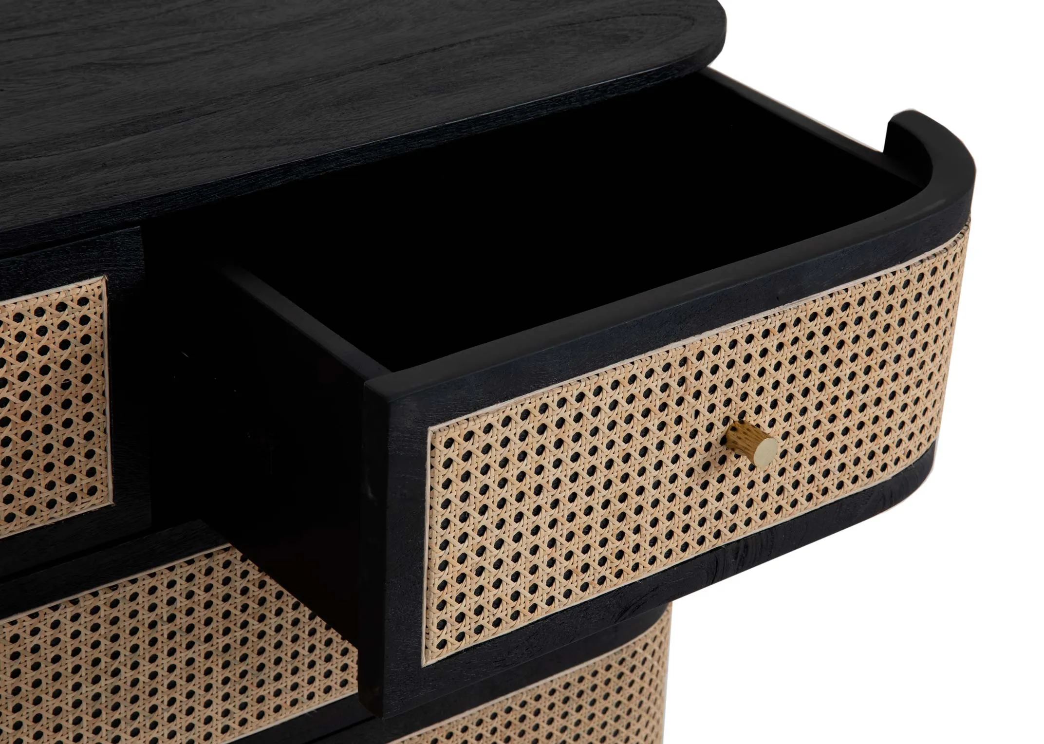 A black mango chest of 4 drawers with rattan weave fronts from EZ Livings Lenny range. Closeup of small drawer open showing finish.