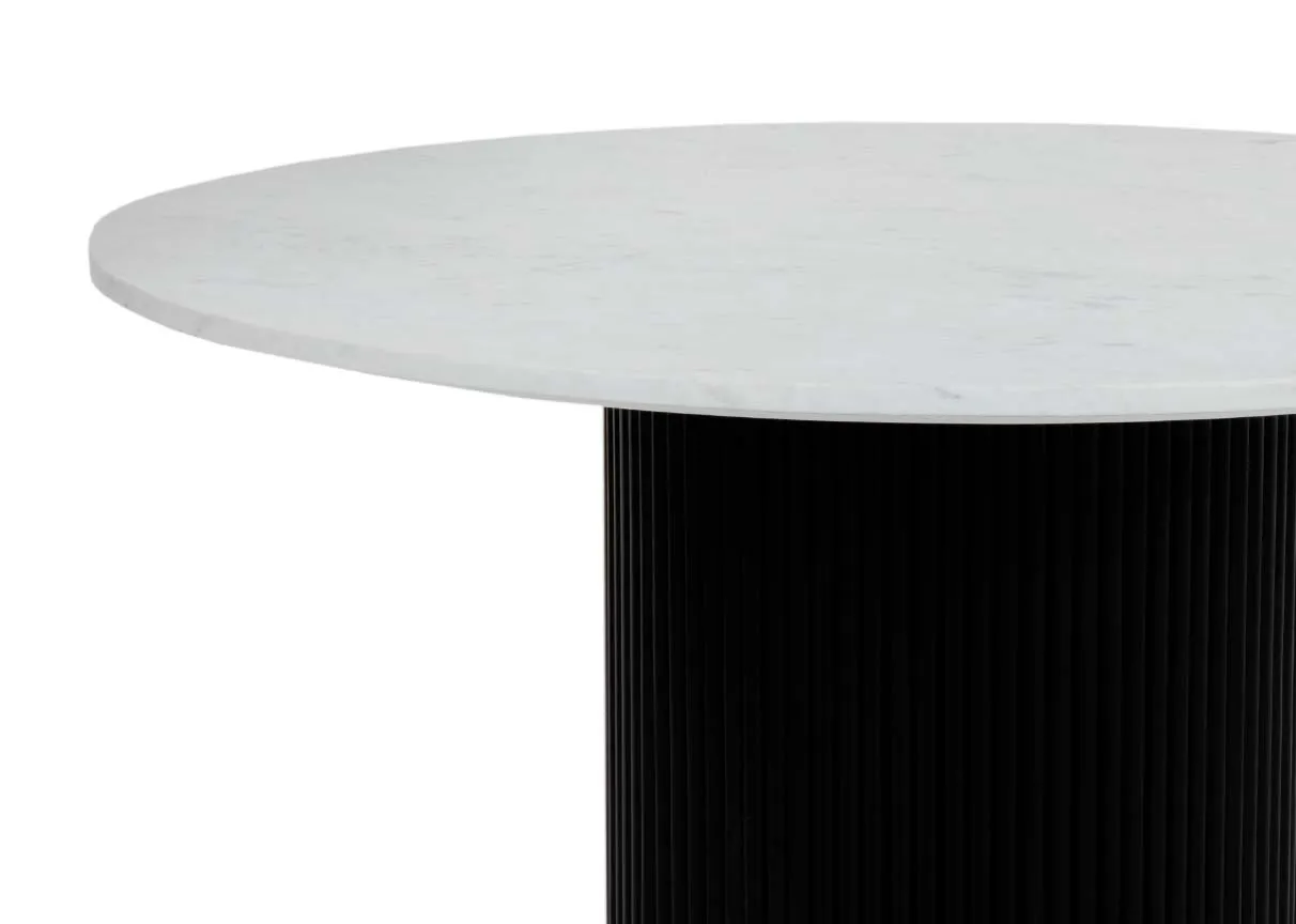 A white marble round dining table with black marble base from EZ Livings Rego range. Closeup of table top.