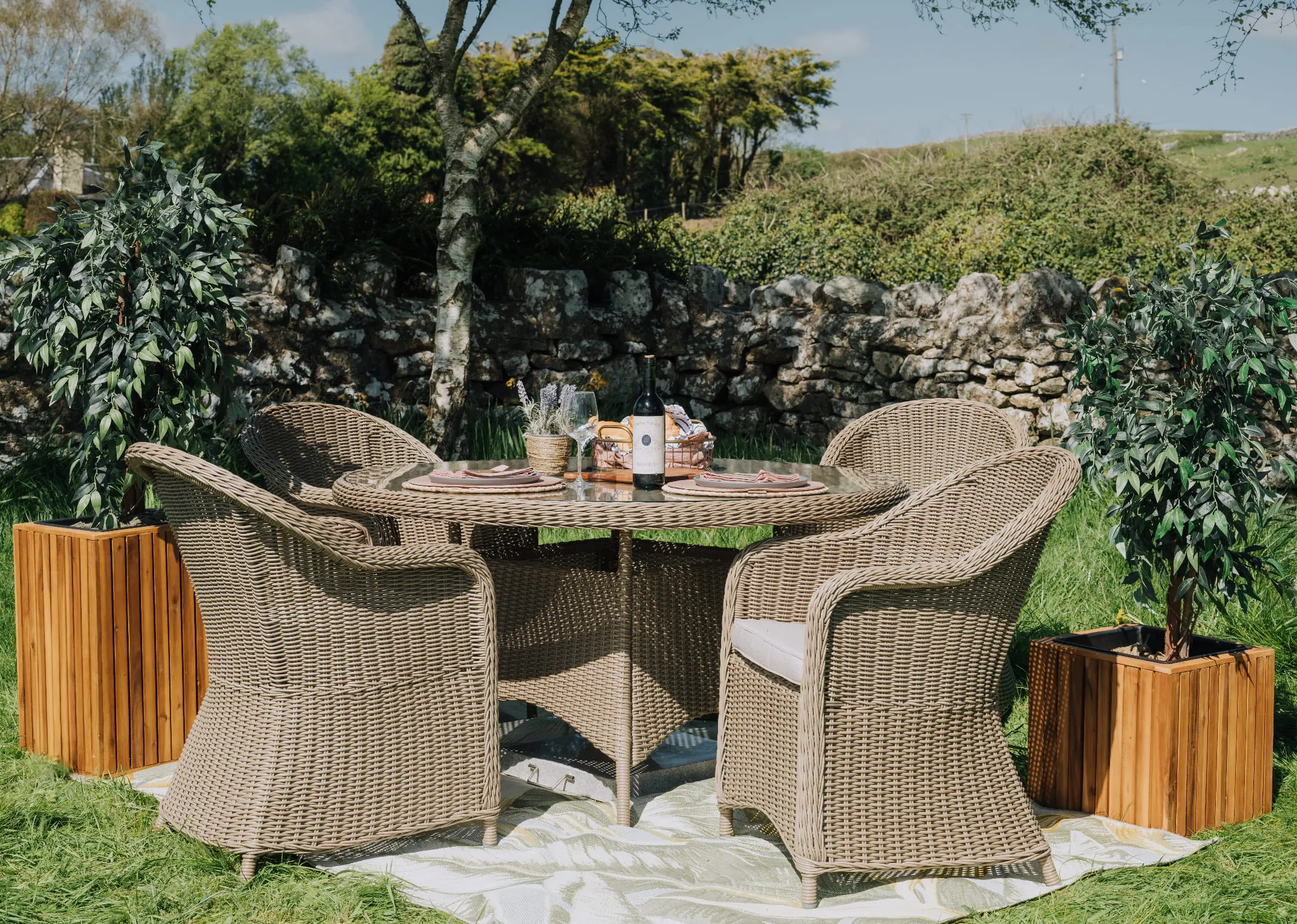 A round back rattan garden chair from EZ Livings Seville range. Front view of rattan covered front and round back.