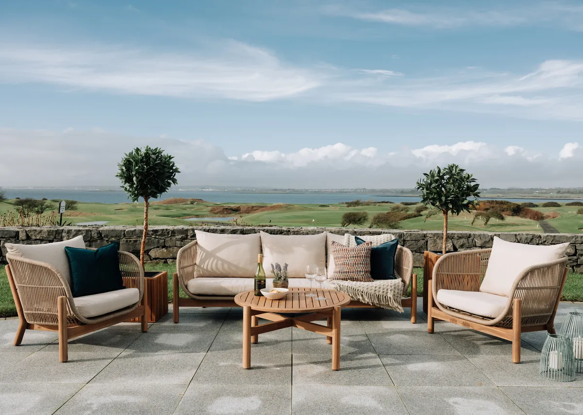 A lifestyle image of the La Palma Garden set with a closeup shot of the rope fabric on the arms of the chairs.