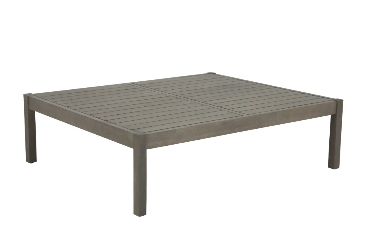 An outdoor lounge set with a 2 seater sofa a table and 2 chairs from EZ Livings Monpellier range. Angled view of low slatted grey acacia table.