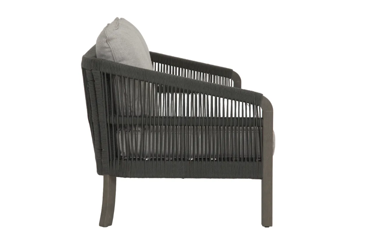 An outdoor lounge set with a 2 seater sofa a table and 2 chairs from EZ Livings Monpellier range. Side view of rope effect on sofa & acacia legs