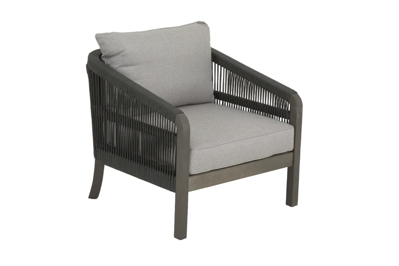 An outdoor lounge set with a 2 seater sofa a table and 2 chairs from EZ Livings Monpellier range. Angled view of armchair