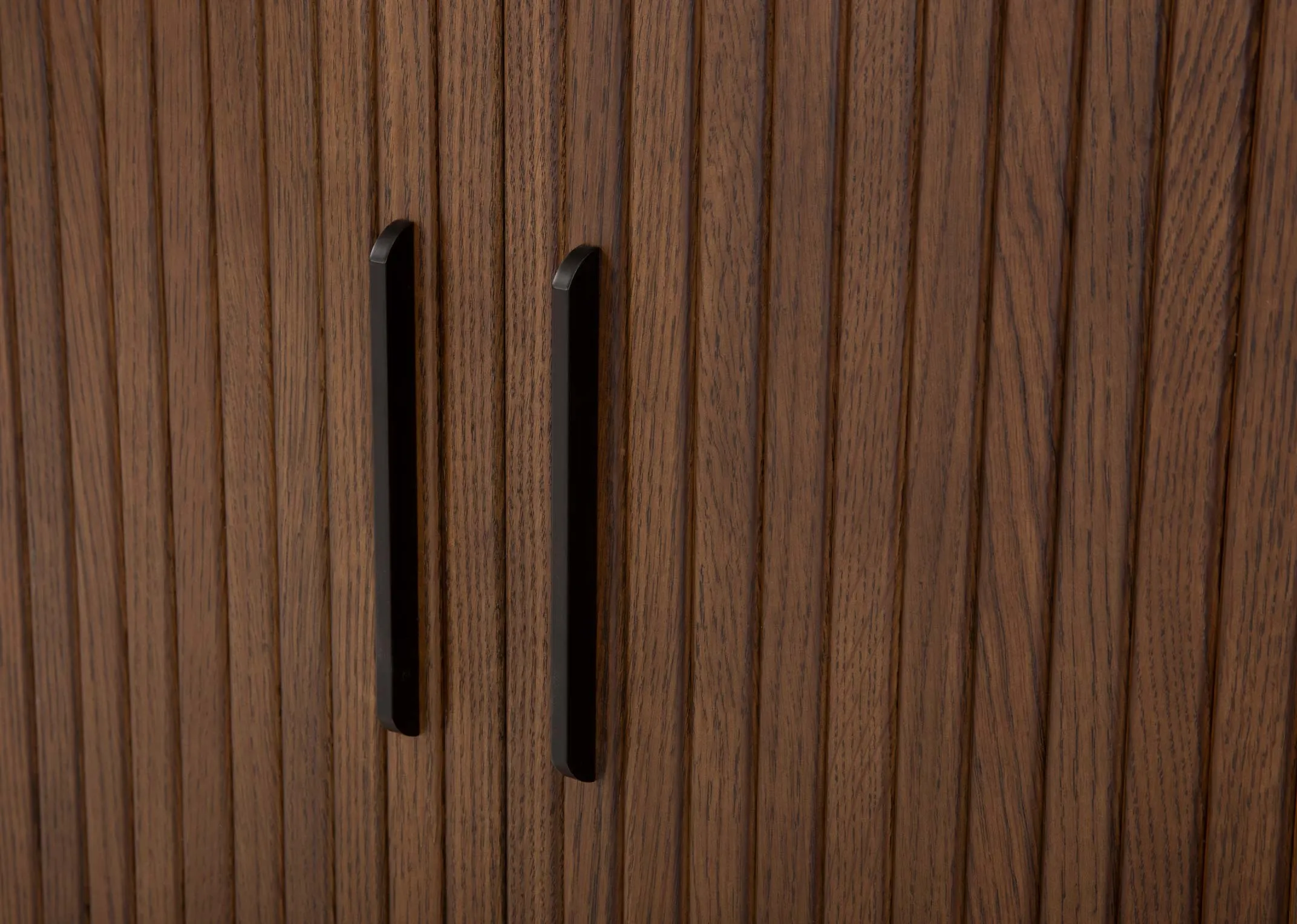 A smoked oak double tambour door sideboard from EZ Livings Nola range. Closeup of textrued wood top