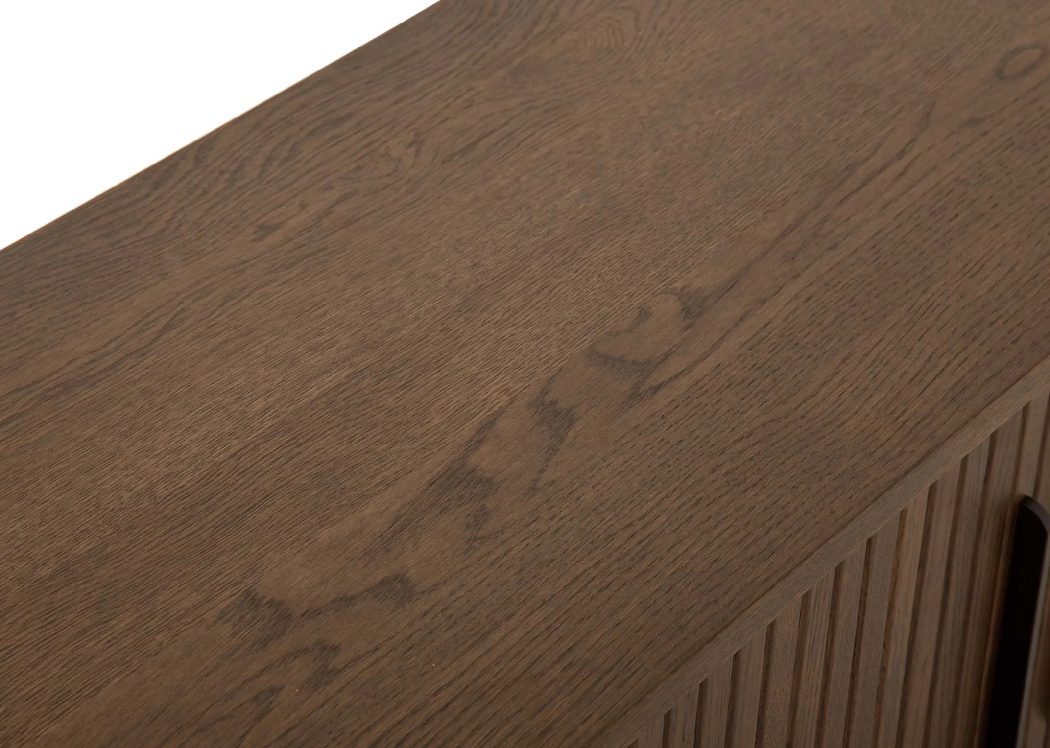 A smoked oak tv unit with a slatted tambour double door from EZ Livings Nola range. Closeup of wood finish top