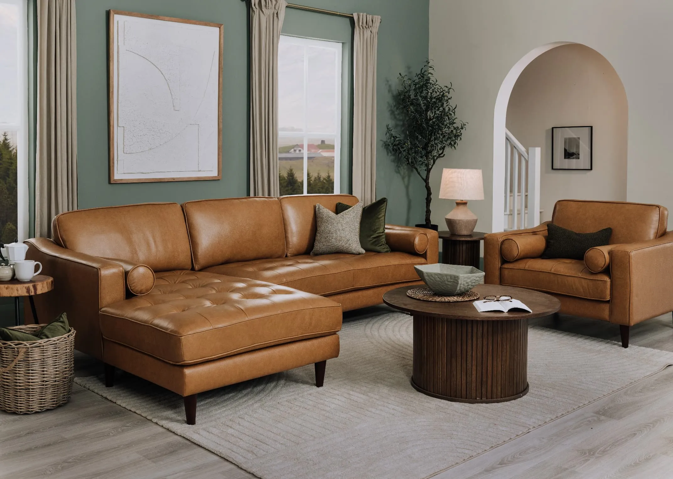 A lifestyle image of the Genoa leather corner chaise with Nola tables and Large Bundi canvas.
