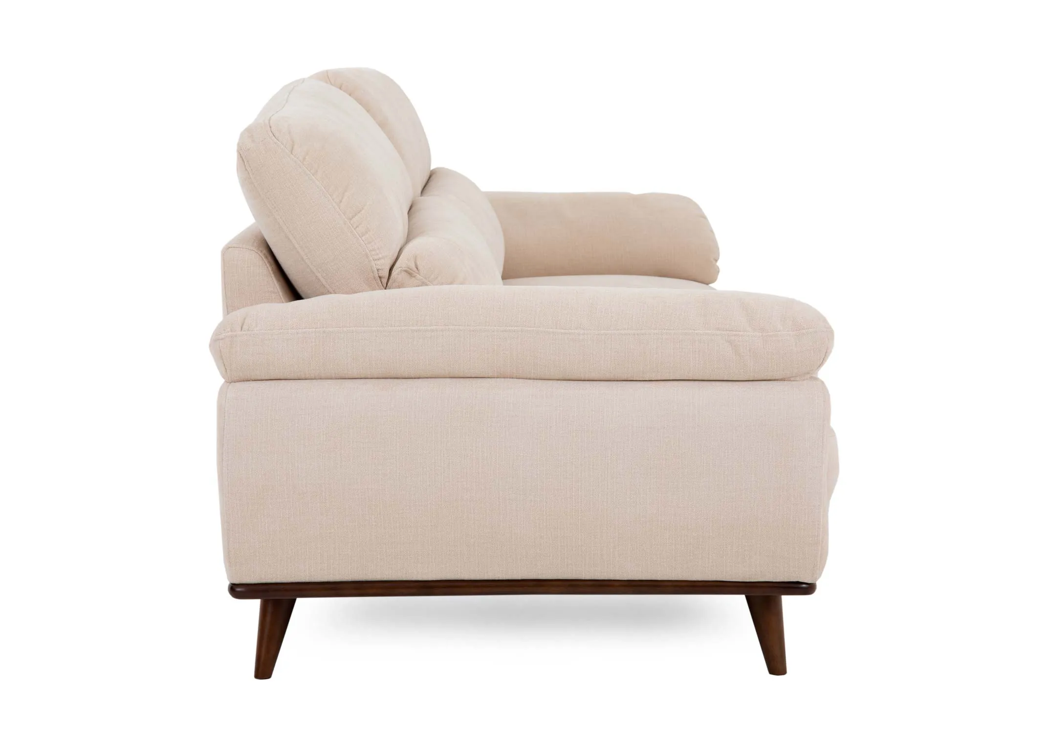 A cream fabric 3 seater sofa from EZ Livings Pippa range. Side view of low padded arms and walnut legs.