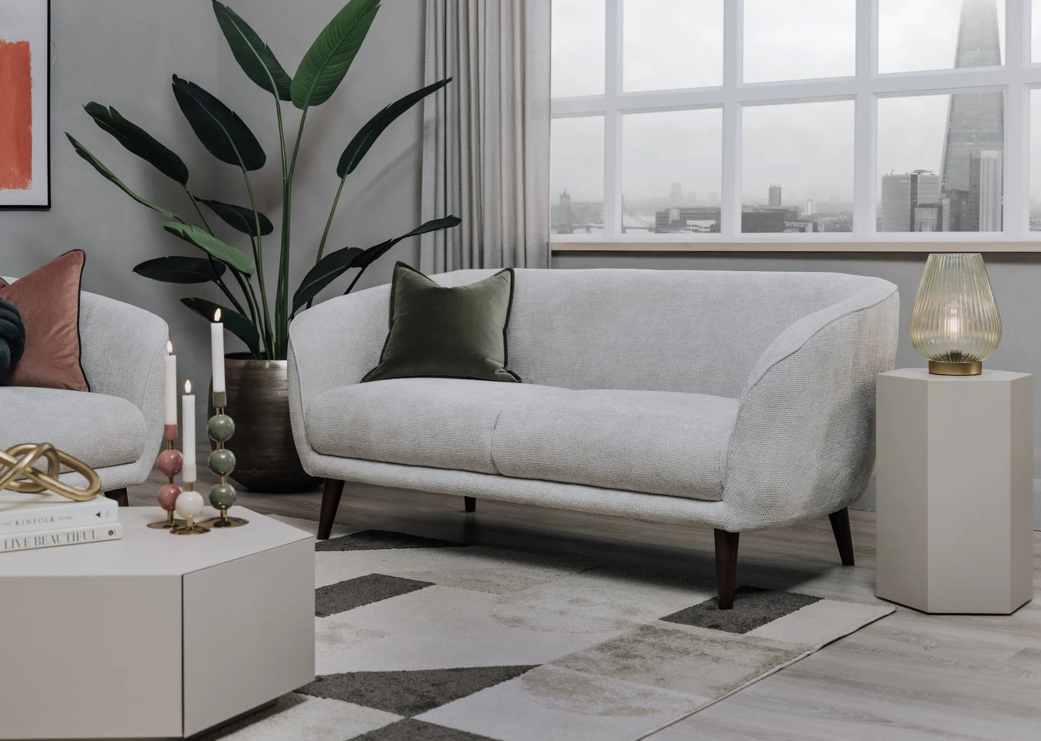 A lifestyle image of the Amber 2 seater with Jonas tables and Limitless prints.