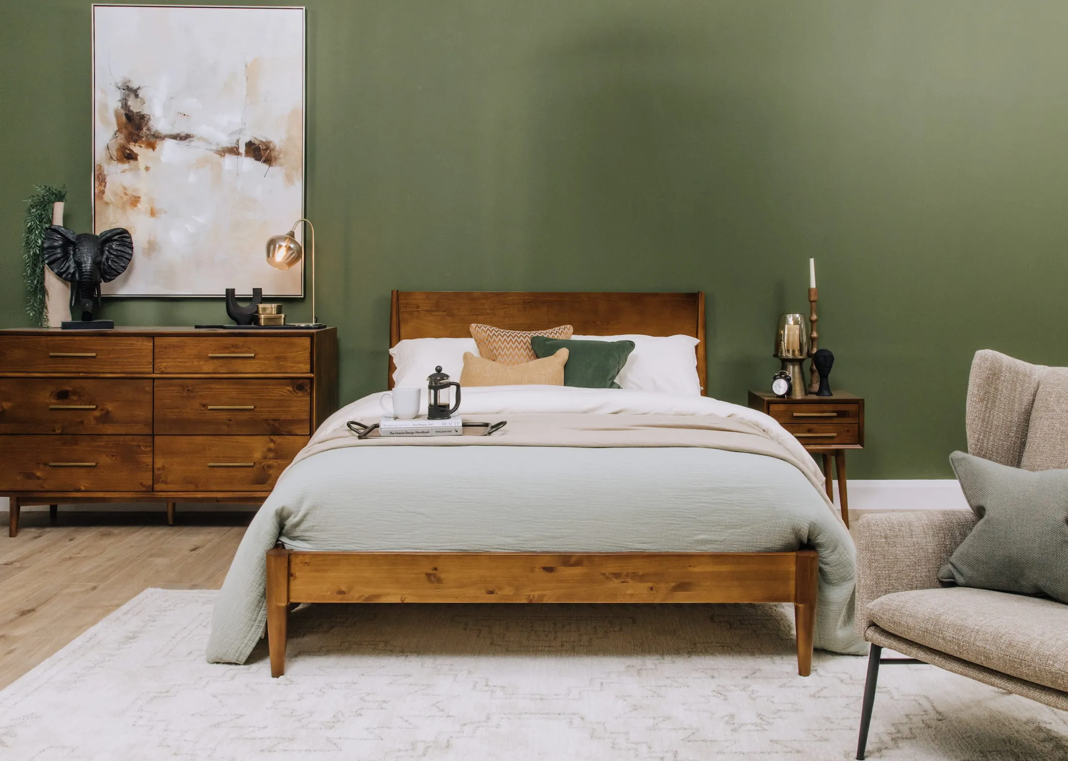 A lifestyle image of the Leya Bedframe with with matching dresser and locker and dreamy canvas.