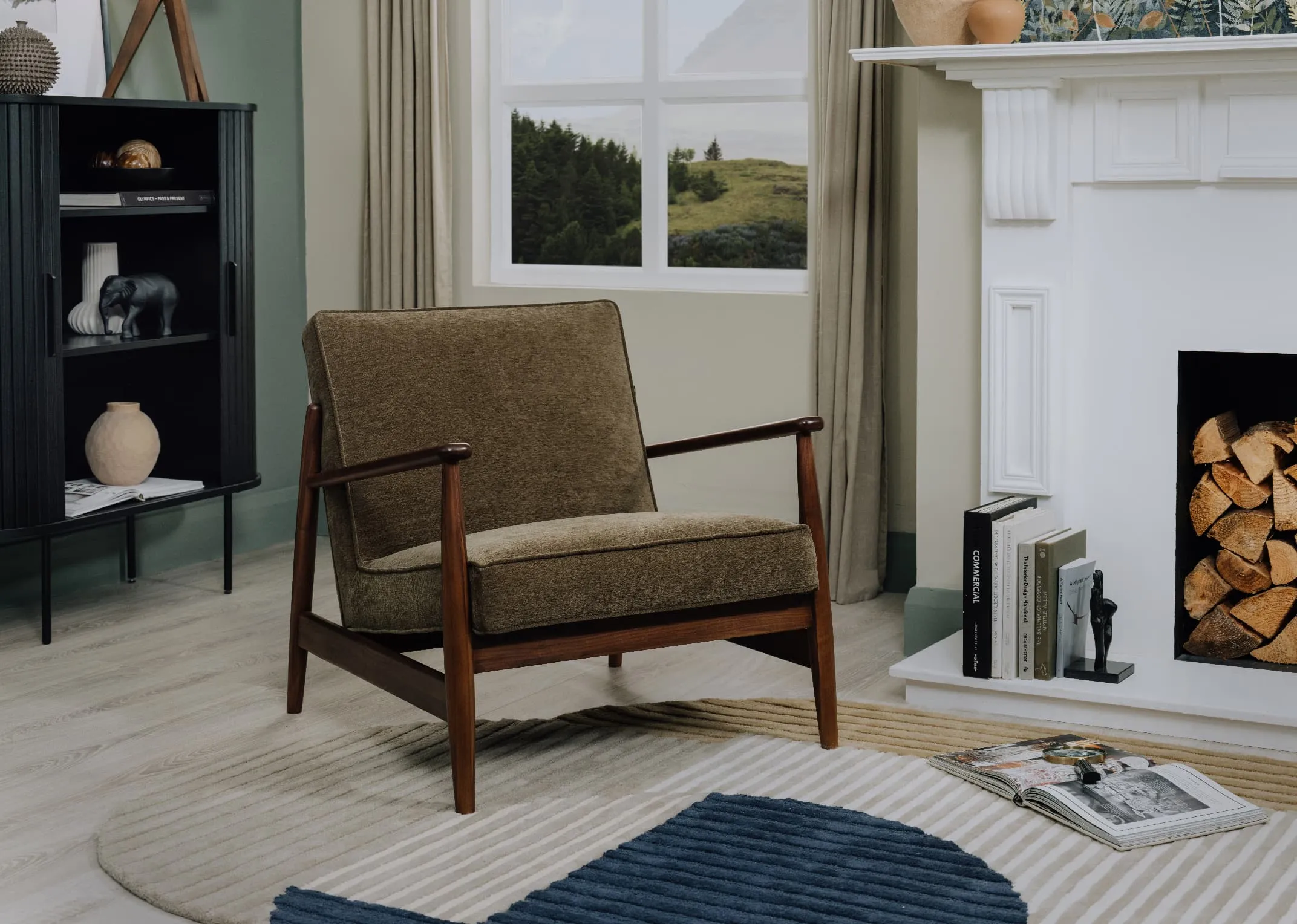 A lifestyle image of the Jordan Lounge Chair with Geo rug and Nola cabinet beside a white fire mantle.