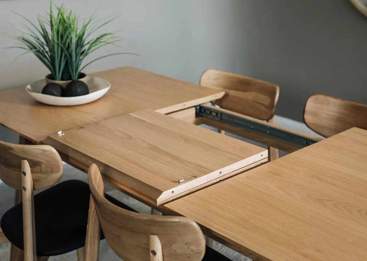 A natural oak dining table from EZ Livings Bari range.Front view of table fixed withour extension leaf