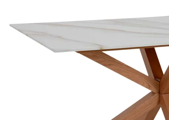 A rectangular melamine top dining tabel with oak legs from EZ Livings Ravello range.Closeup of the white marble look top