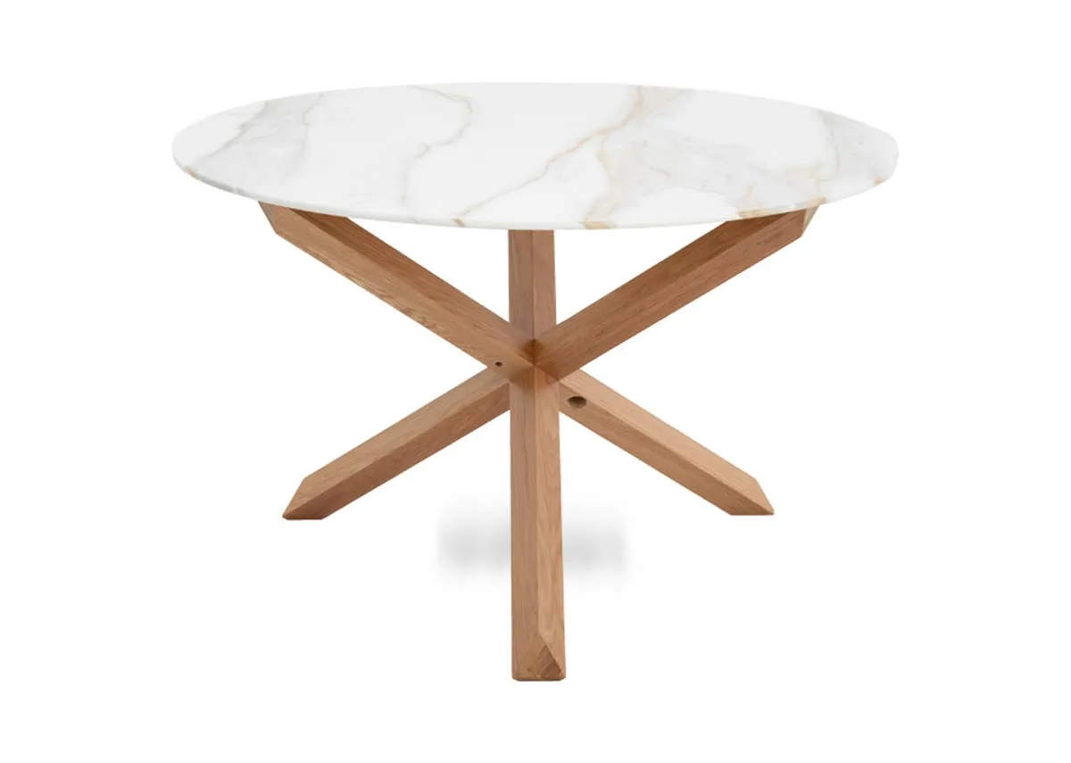 A round melamine top dining table with oak legs from EZ Livings Ravello range. Angled view