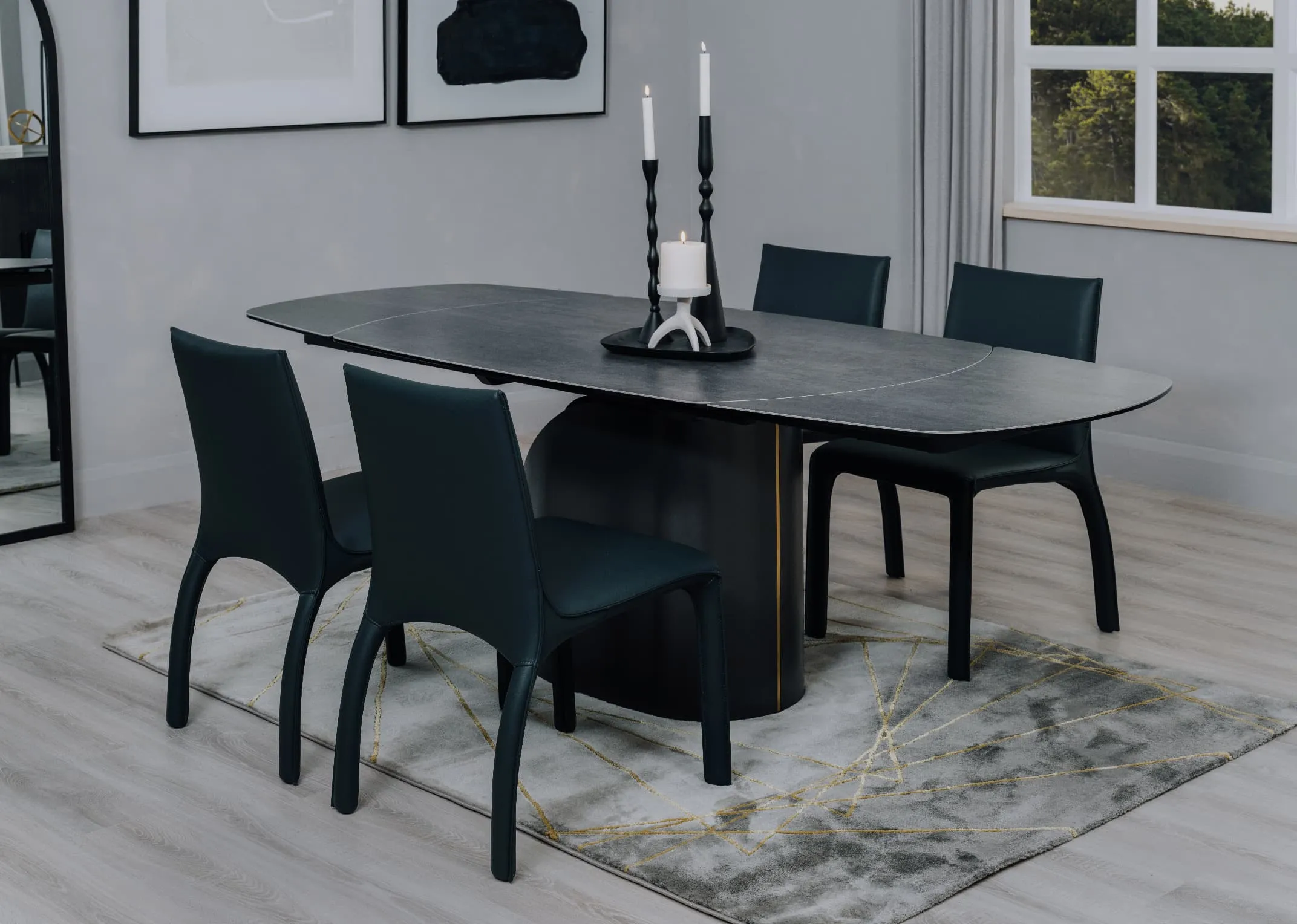 A lifestyle image of the Hamilton dining table with Rocco chairs abd Avery rug.