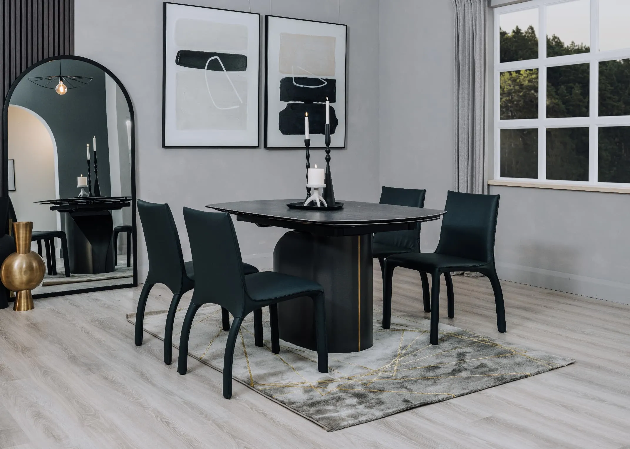 A dark grey ceramic dining table from EZ Livings Hamilton range. Angled view of extendable leaves