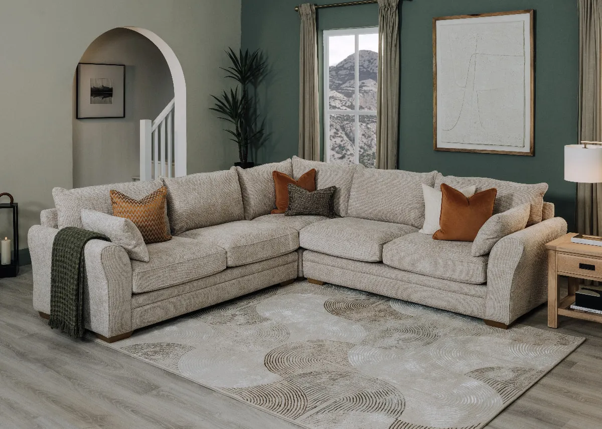 A lifestyle image of the Skyline Corner Sofa with Albany side table.