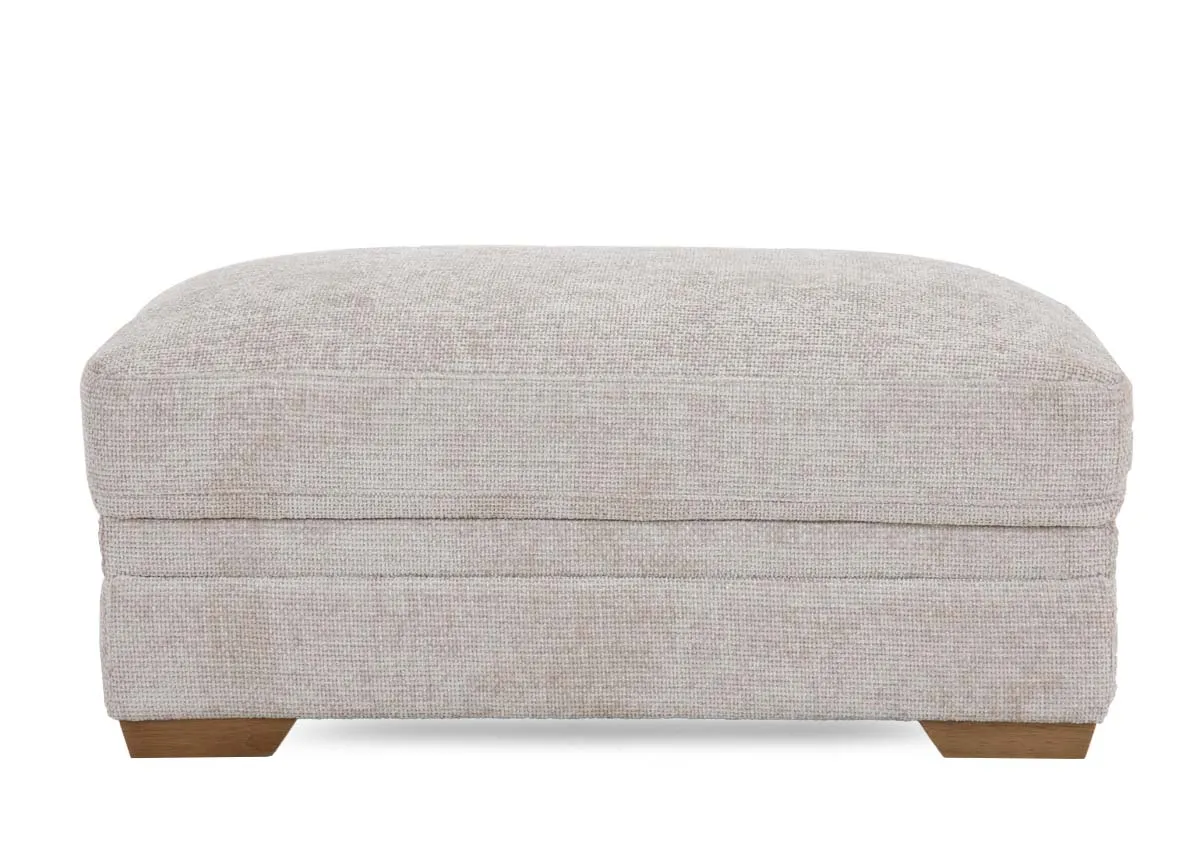 A large beige fabric rectangular footstool from EZ Livings Skyline range.Front view