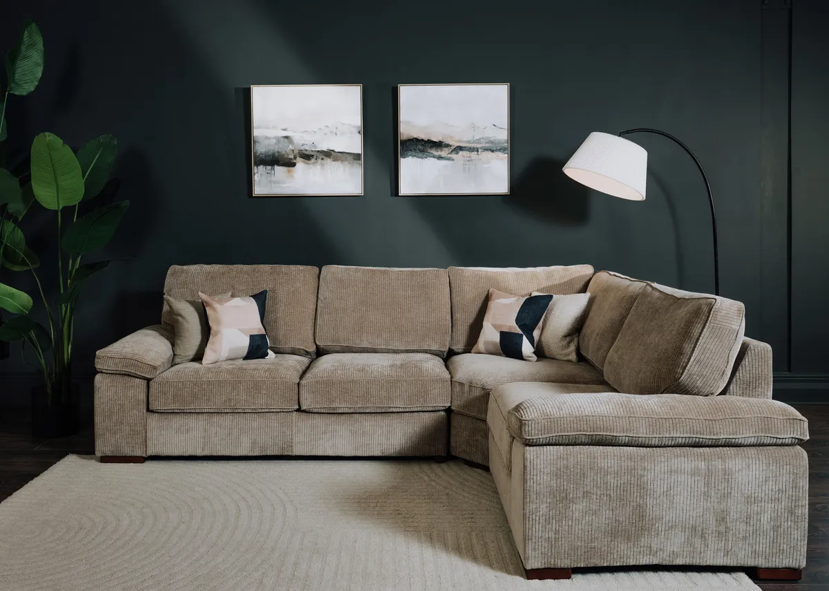 A lifestyle image of the westport corner sofa with Arc lamp and Misty View canvas prints