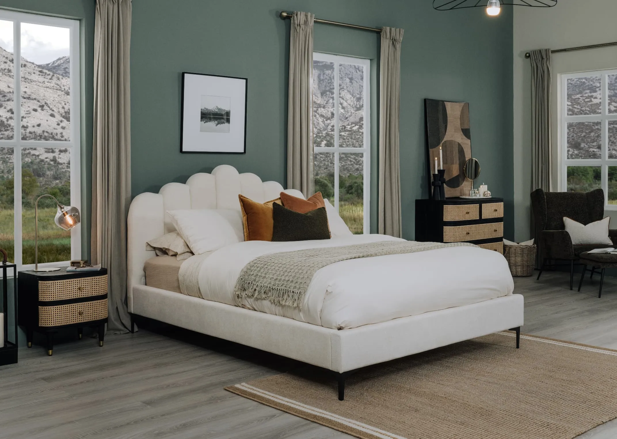 A lifestyle image of the Faye cream velvet bedframe with Lenny locker and Boston green chair and footstool.