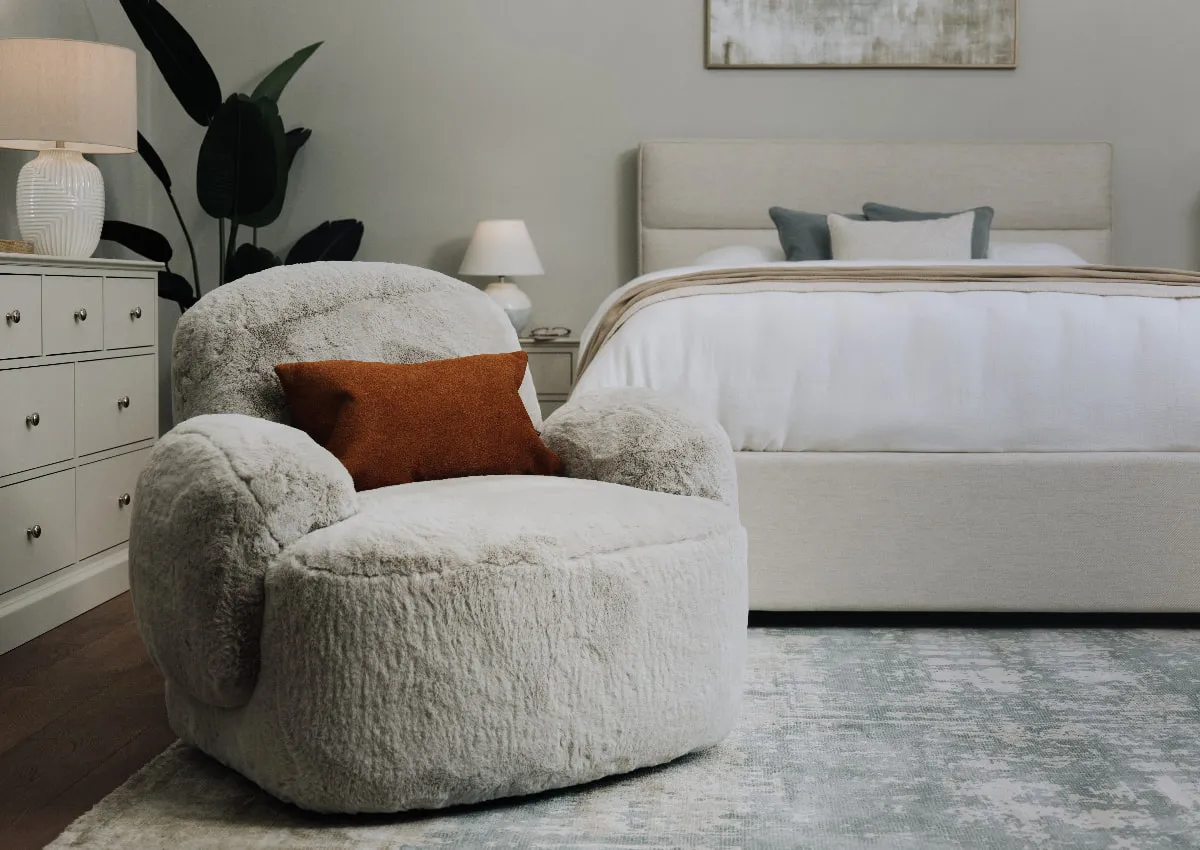 A lifestyle image of the Fury Swivel Chair with Ebony bed and Rivendale furniture