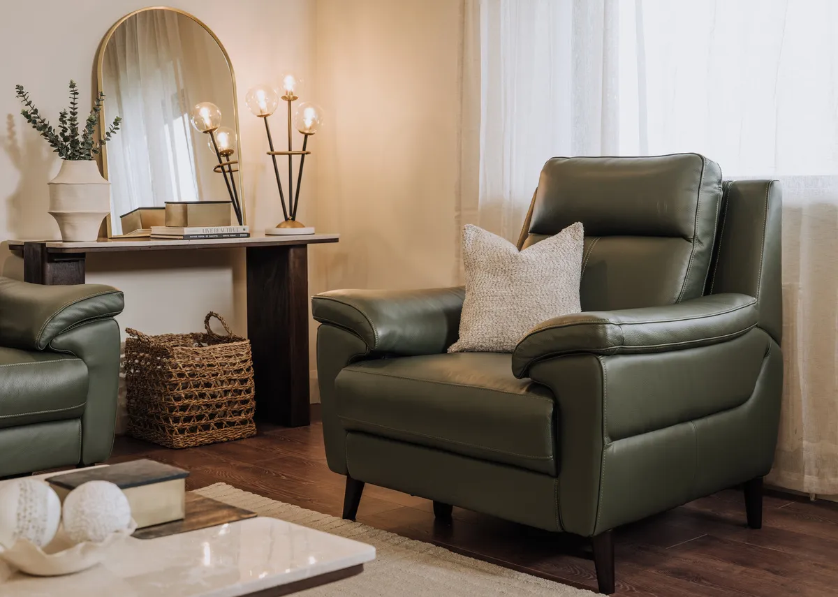 A lifestyle image of the Elliot leather armchair with the Windsor console table with Flynn mirror.