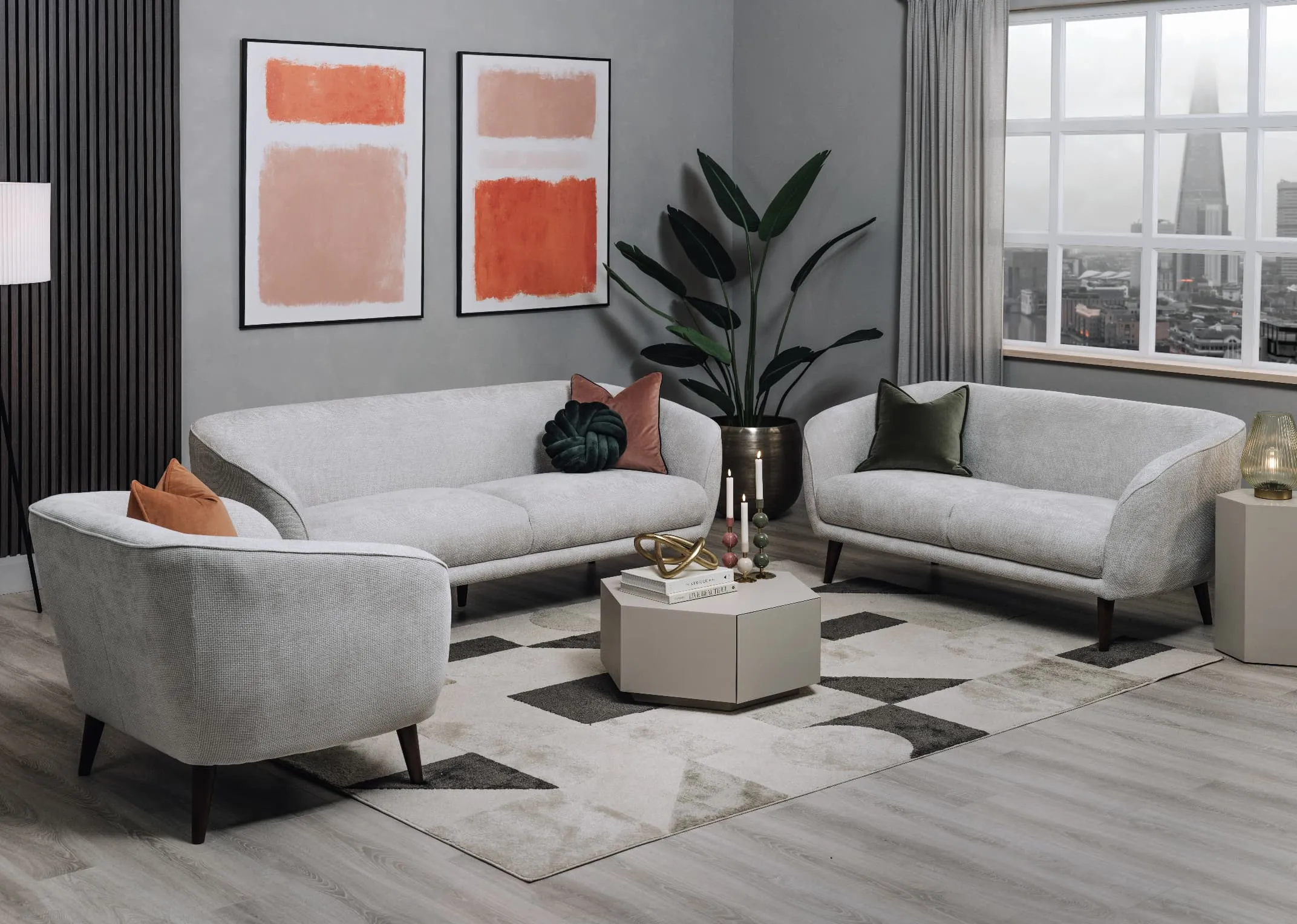 A lifestyle image of the Amber sofa range with Limitless I & II on the wall with Jonas Oatmeal tables.