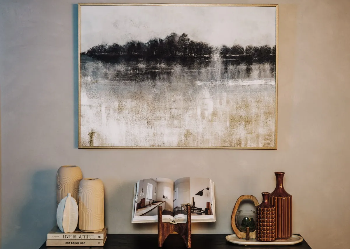 A lifestyle image of the Adrift canvas with a selection of accessories on a sideboard
