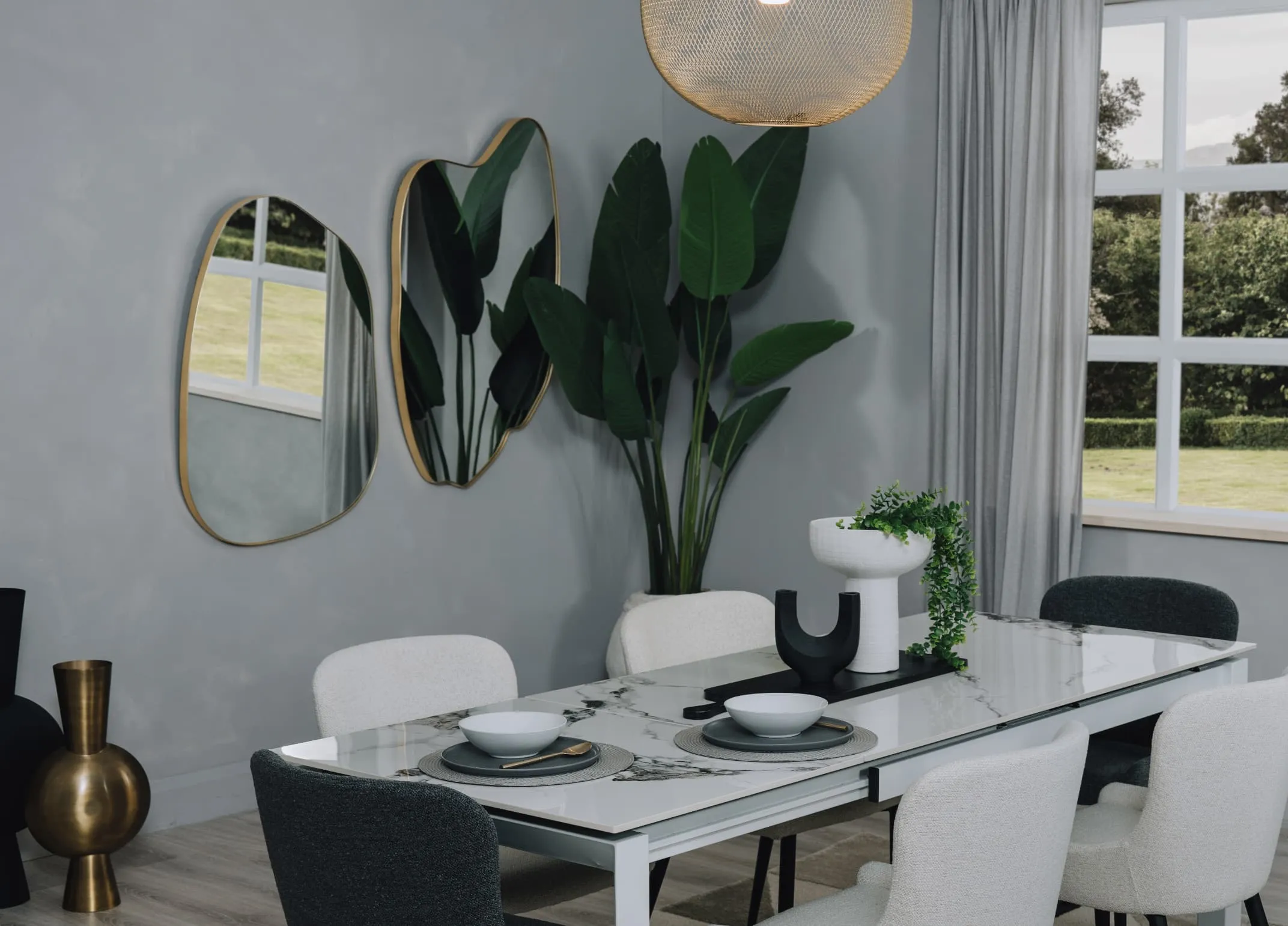 A lifestyle image of the Samara white dining table with Colson and Benton wall mirrors.