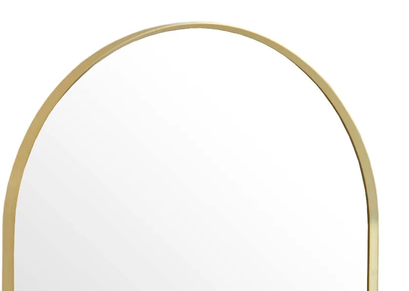 A gold arched mirror from EZ Livings Flynn range. Closeup of gold edge