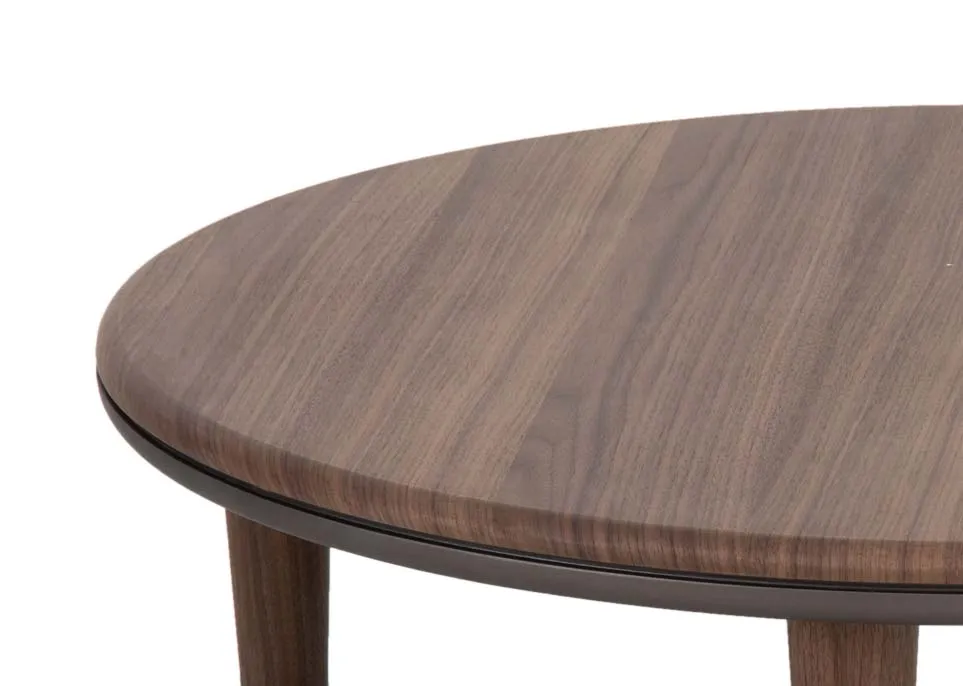 A walnut round coffee table from EZ Livings Breeze range. Closeup of walnut veneer finish.