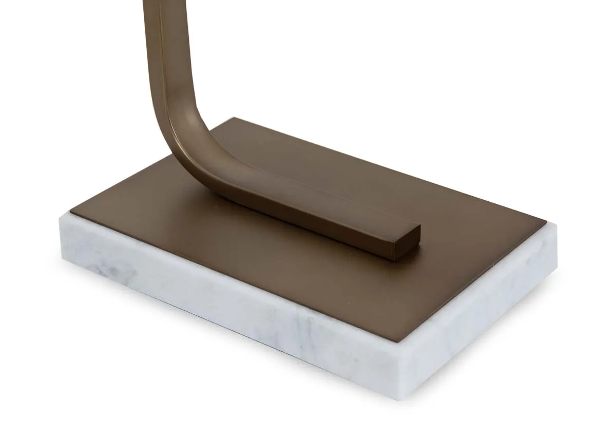 A gold metal table lamp with White shade from EZ Livings Phoenix range.Closeup of brass and marble trim base.