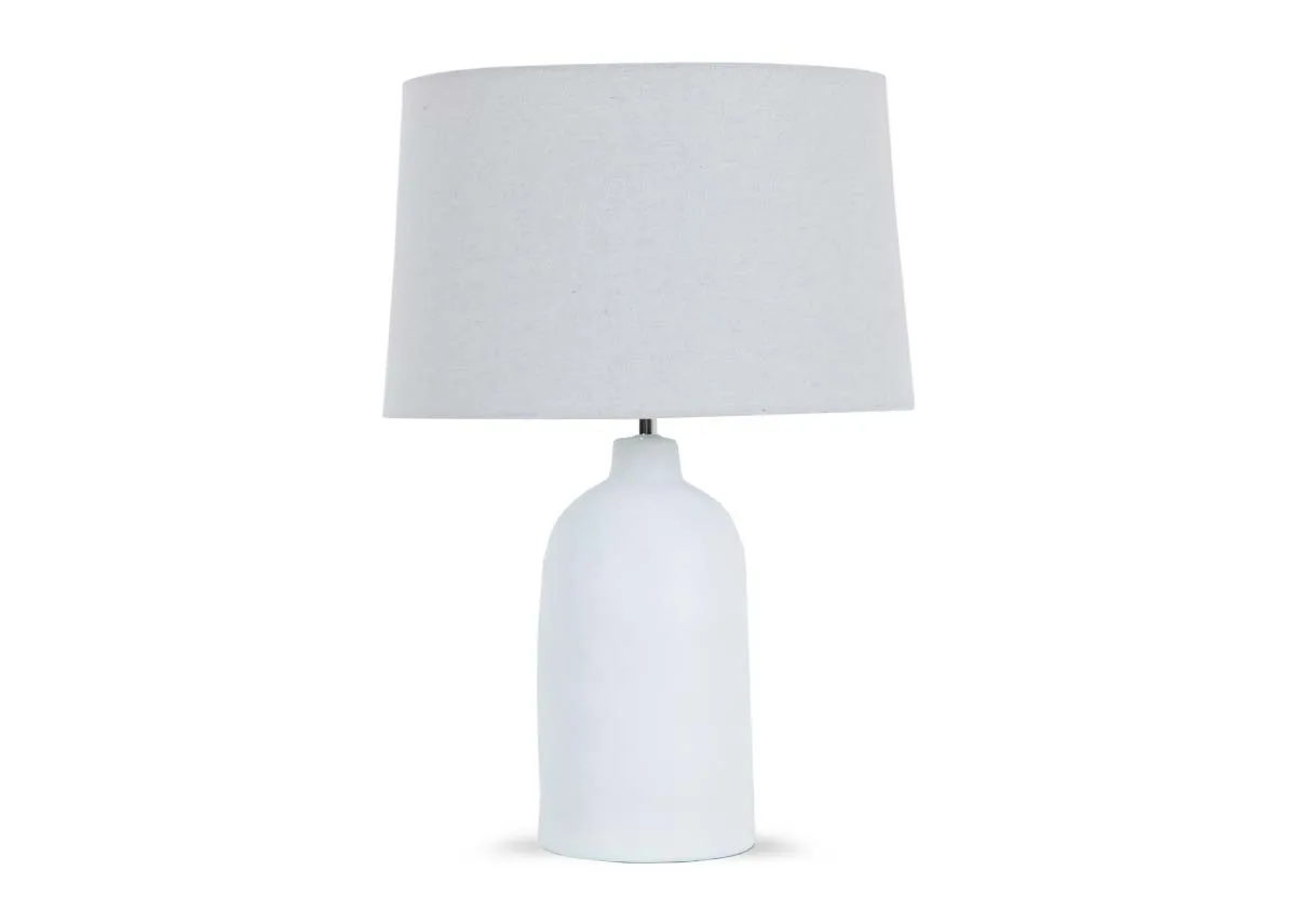 A white table lamp from EZ Livings Foyle range. Front view of ceramic base and large white shade.